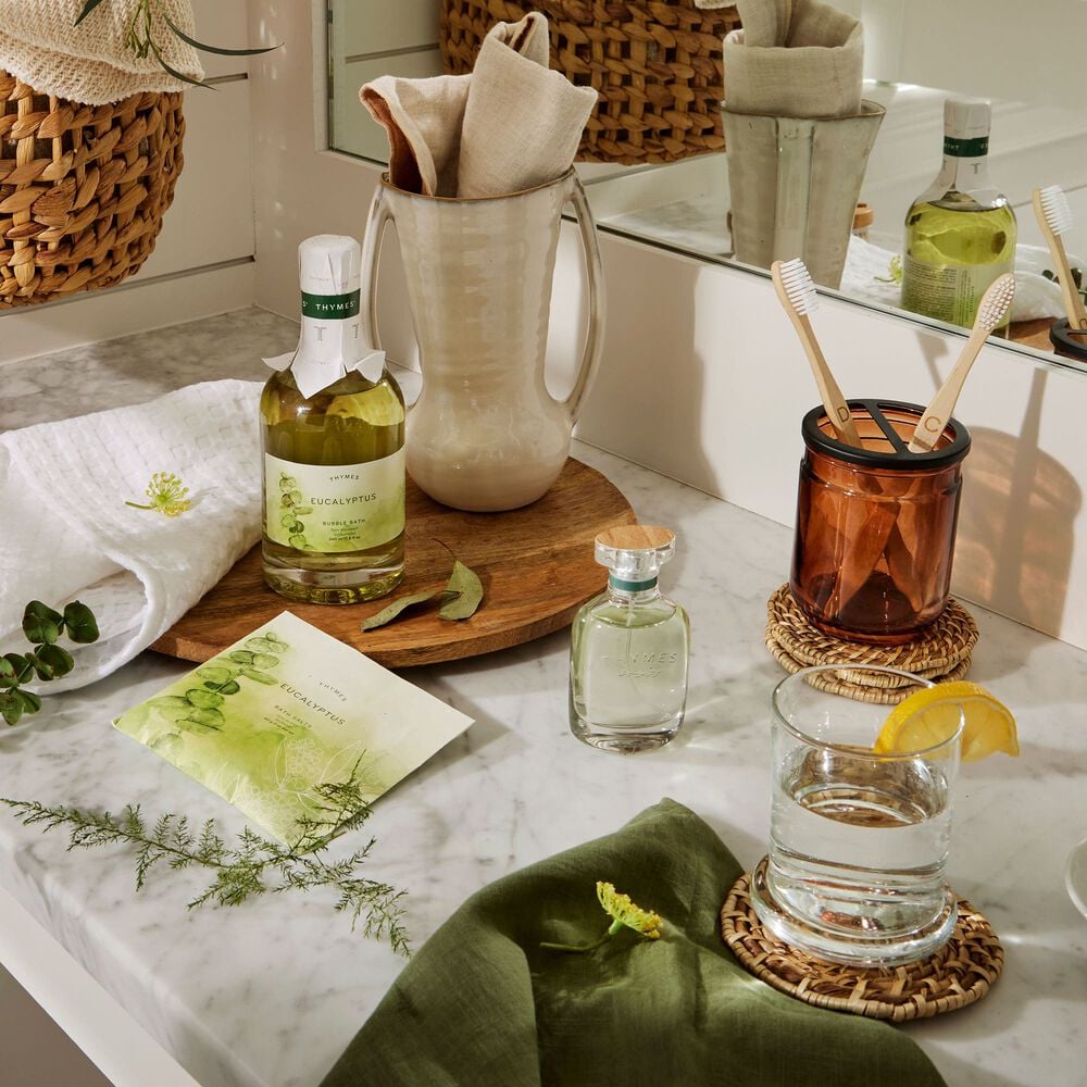 Thymes Eucalyptus Cologne is an Energizing Fragrance featured on bathroom countertop image number 1